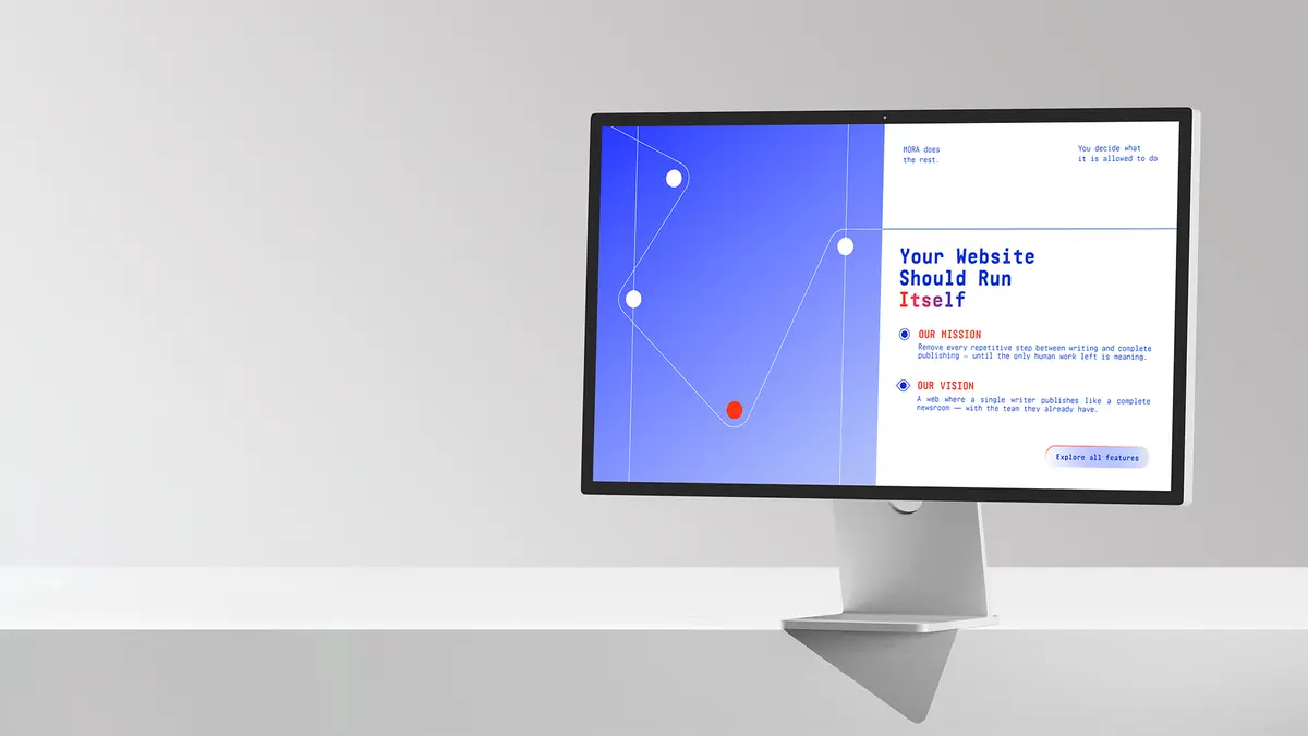 A desktop monitor showing a Mora page with its mission and vision