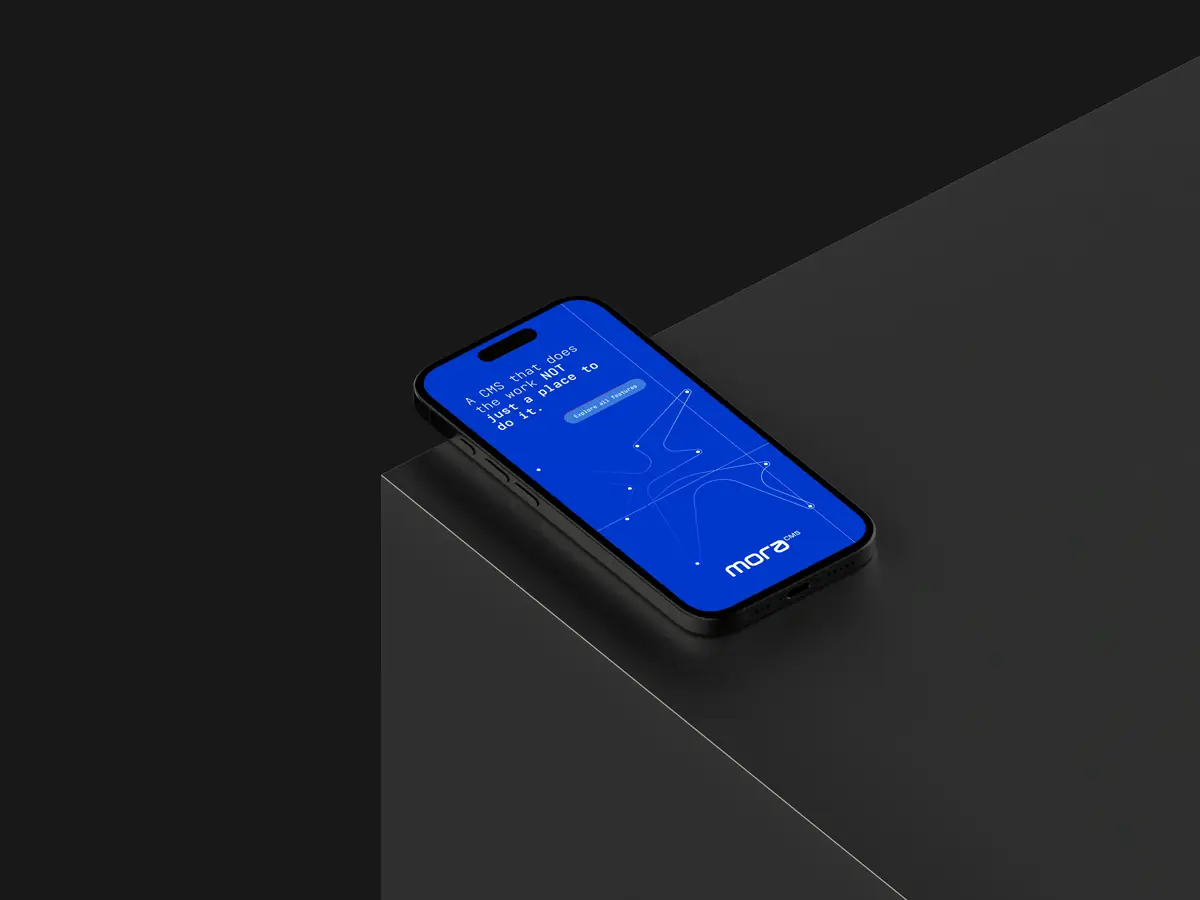 A phone on a dark plinth showing the Mora home screen