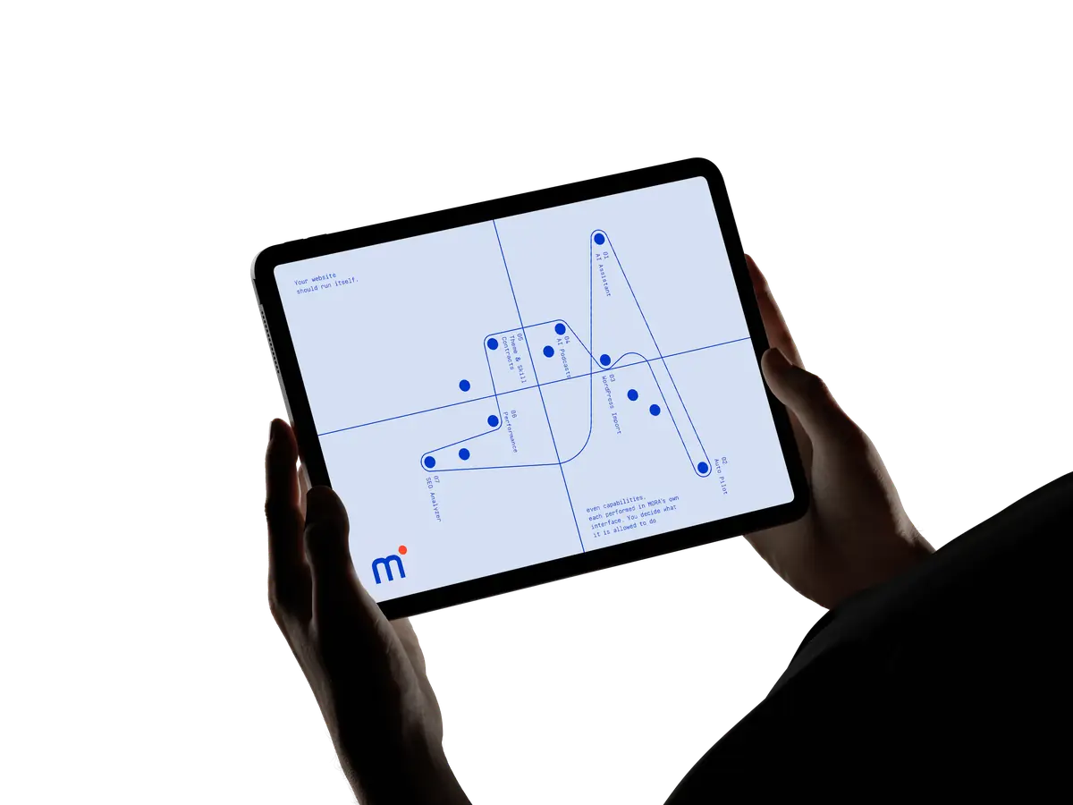 A tablet showing a Mora configuration map, held in two hands